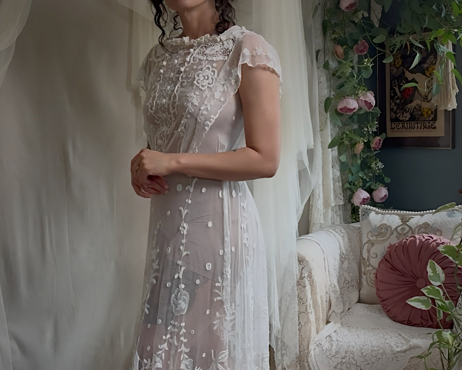 Woman wearing antique lace wedding dress from the Edwardian Era 