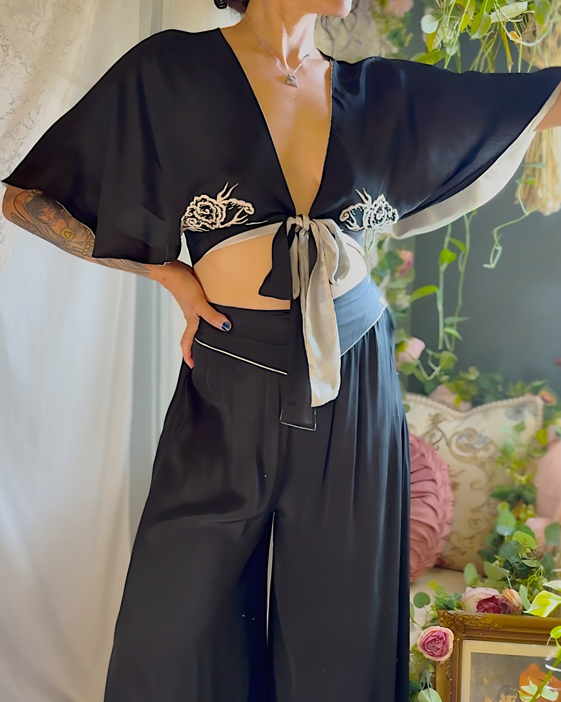 Woman wearing antique 1920s silk Chinese pajama set 