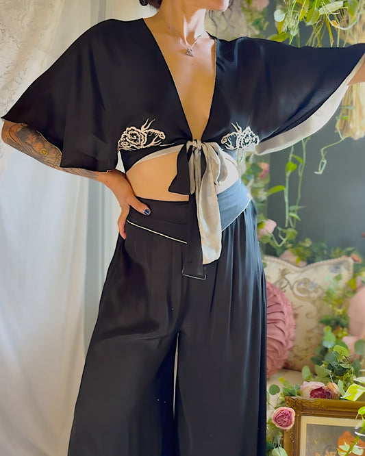 Woman wearing antique 1920s silk Chinese pajama set 