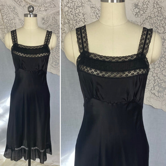 Vintage 1950's Slip | Inky Black Rayon Satin with Crystal Pleated Chiffon Ruffled Hem & Lace | Size XS - Daggers & Dames